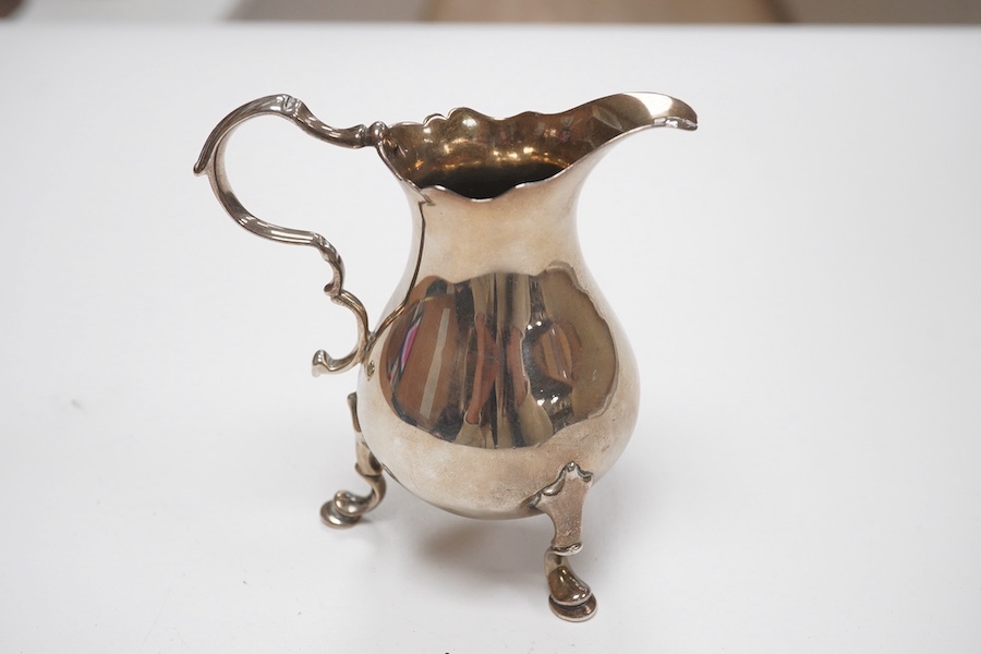 A mid 18th century silver cream jug, indistinct marks, 92mm, 3.3oz. Condition - fair